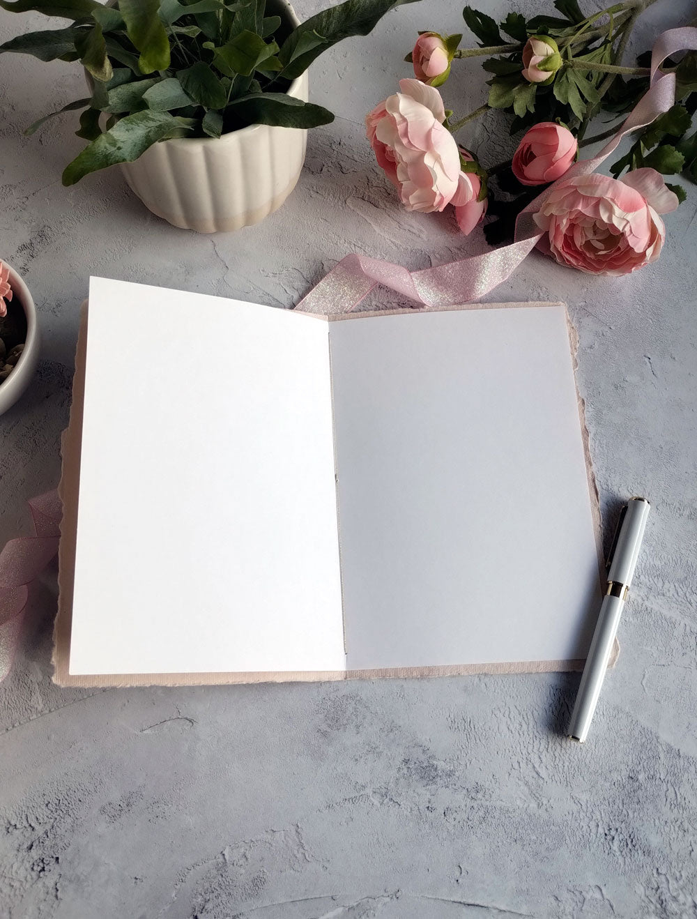 Inside of Handmade Pink A5 Wedding card with floral design.