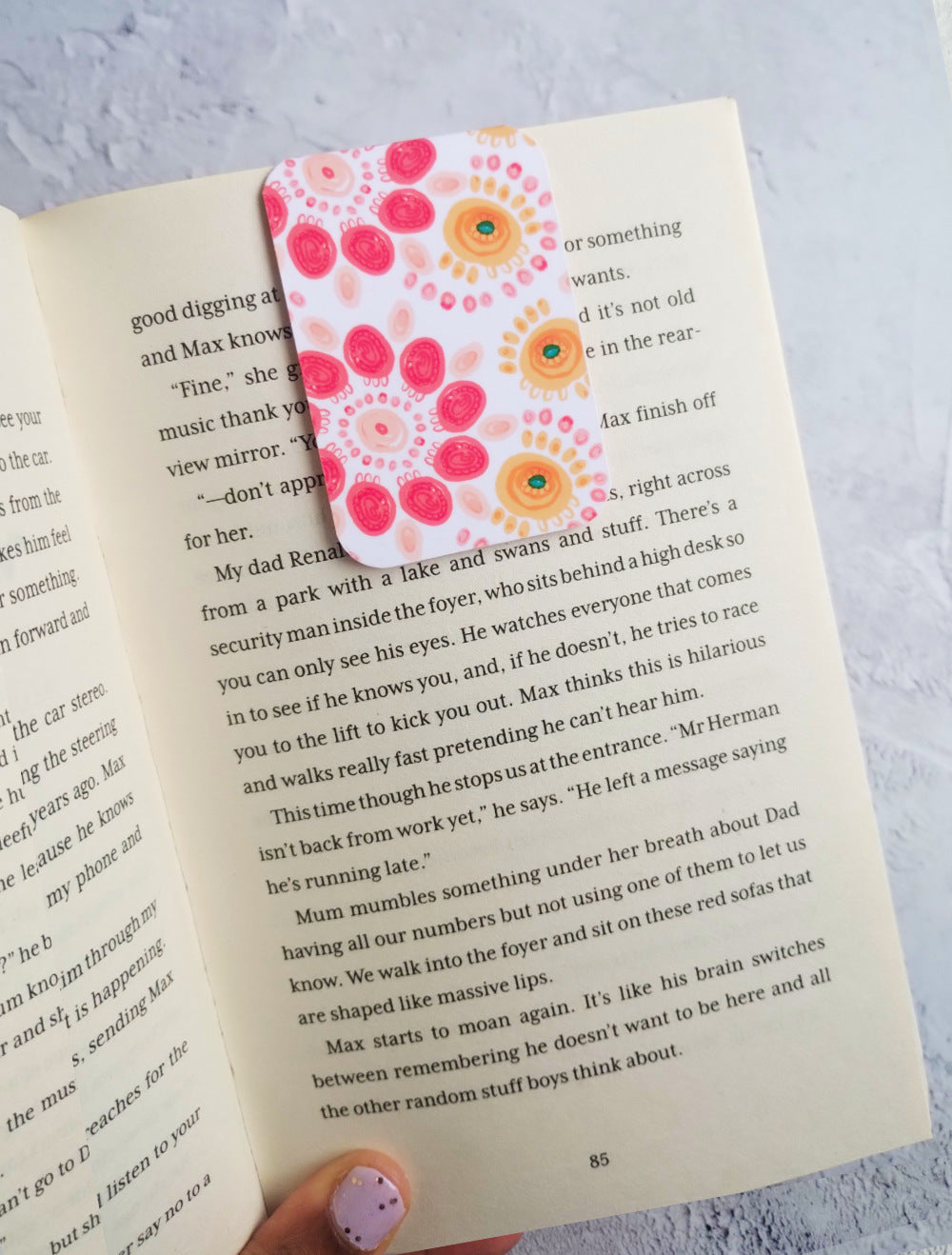 Summa Carnival bookmark in an open book