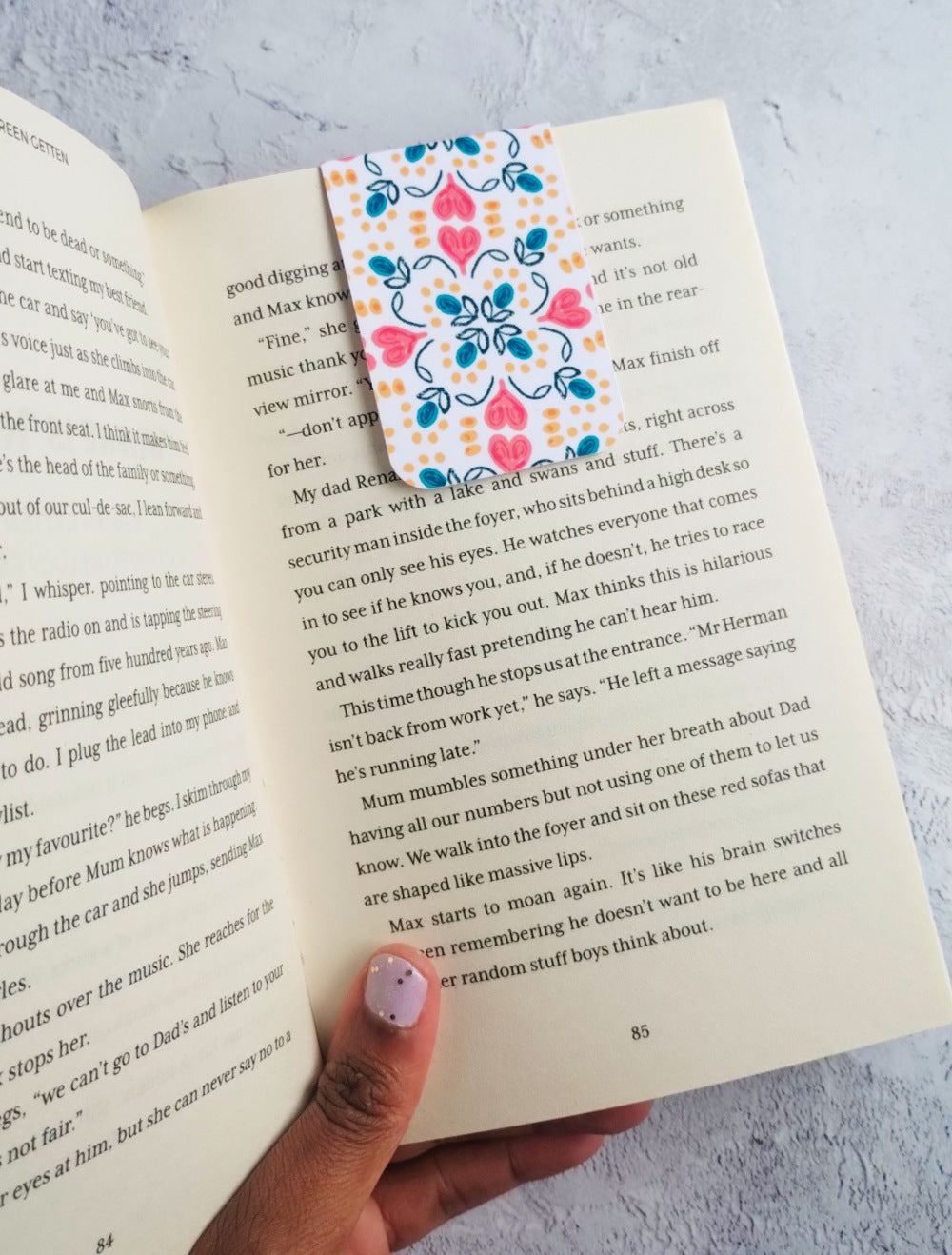 Open book with a colourful Summa Love bookmark