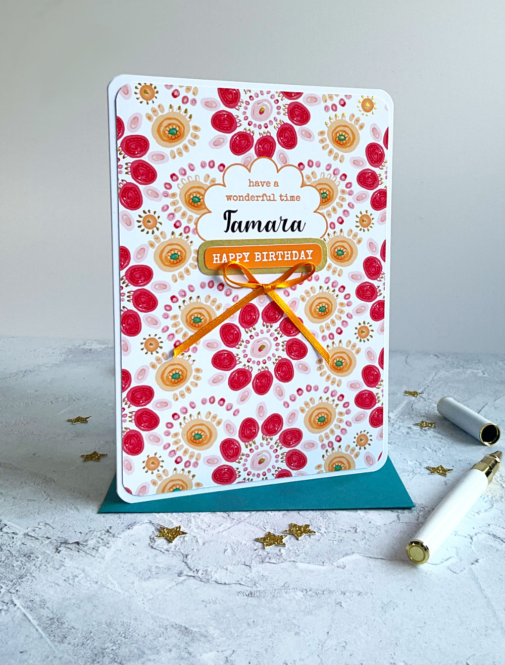 Personalised Summa Carnival Birthday card with colourful design finished with a golden yellow bow