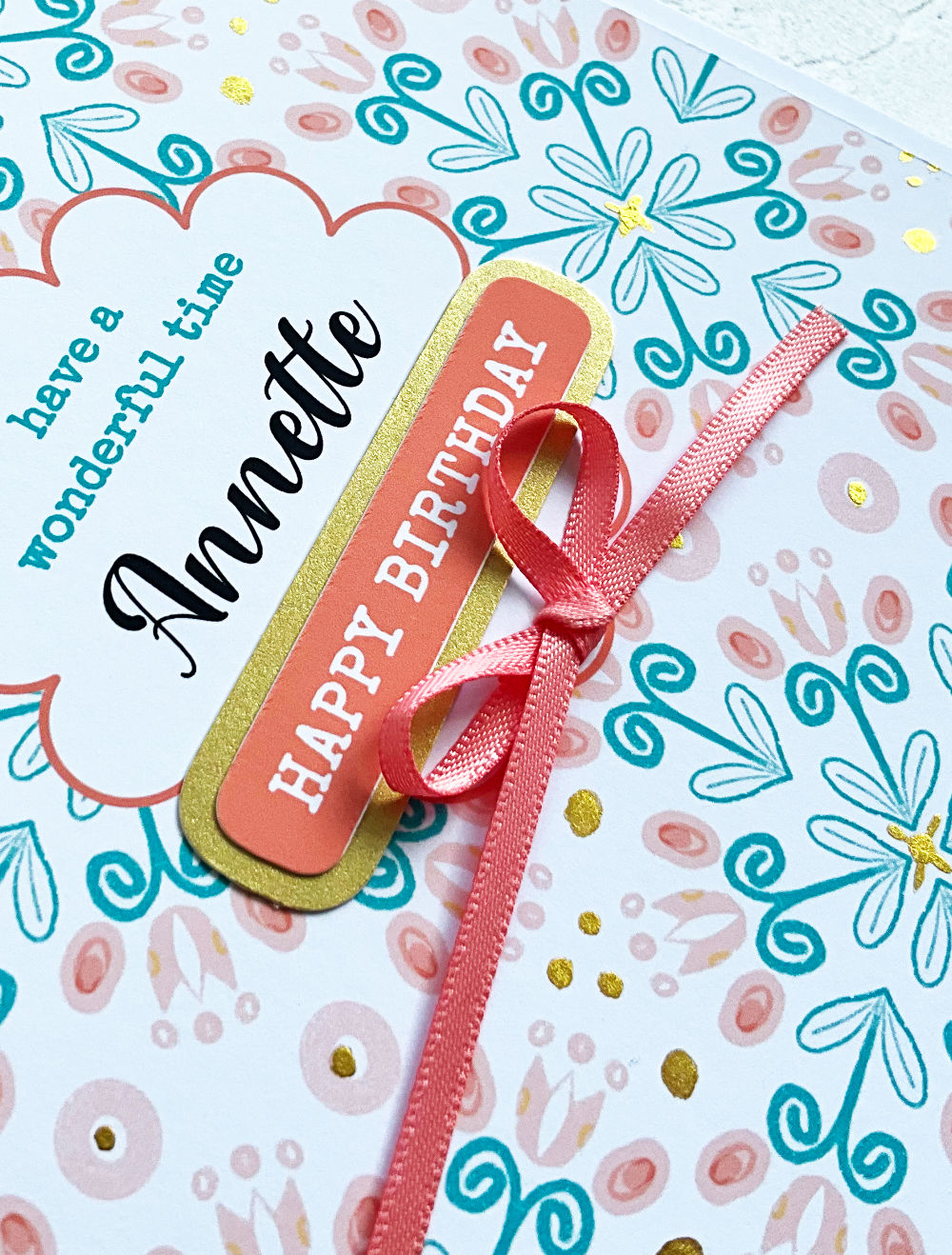 Close up of Summa Tulips Personalised Birthday card with teal and salmon pink pattern and satin bow