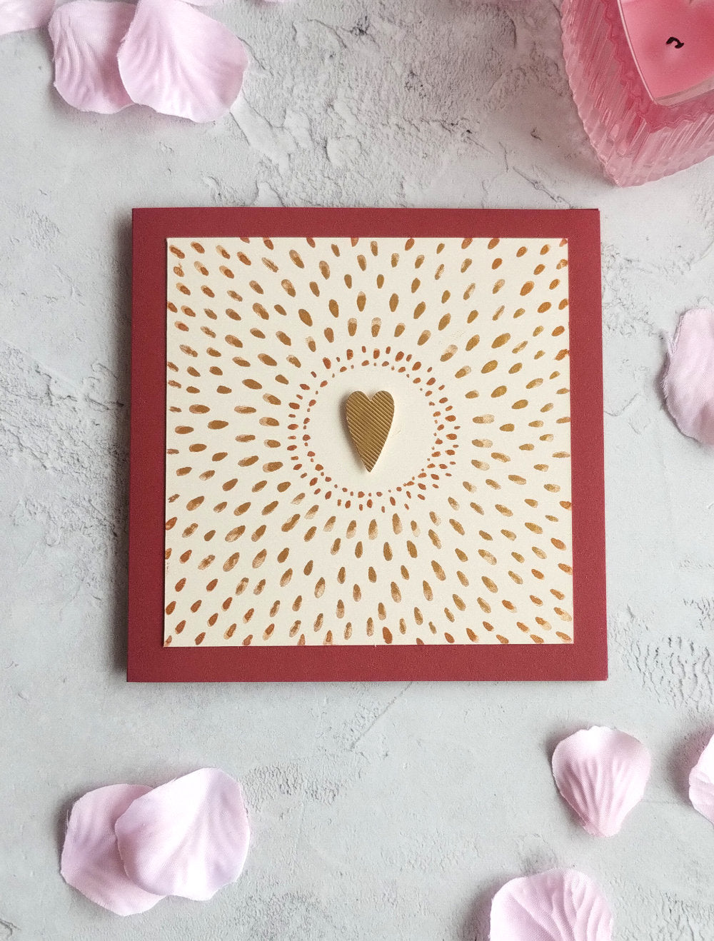 Love Shines Valentine's Card with gold heart design on a raspberry background with pink petals