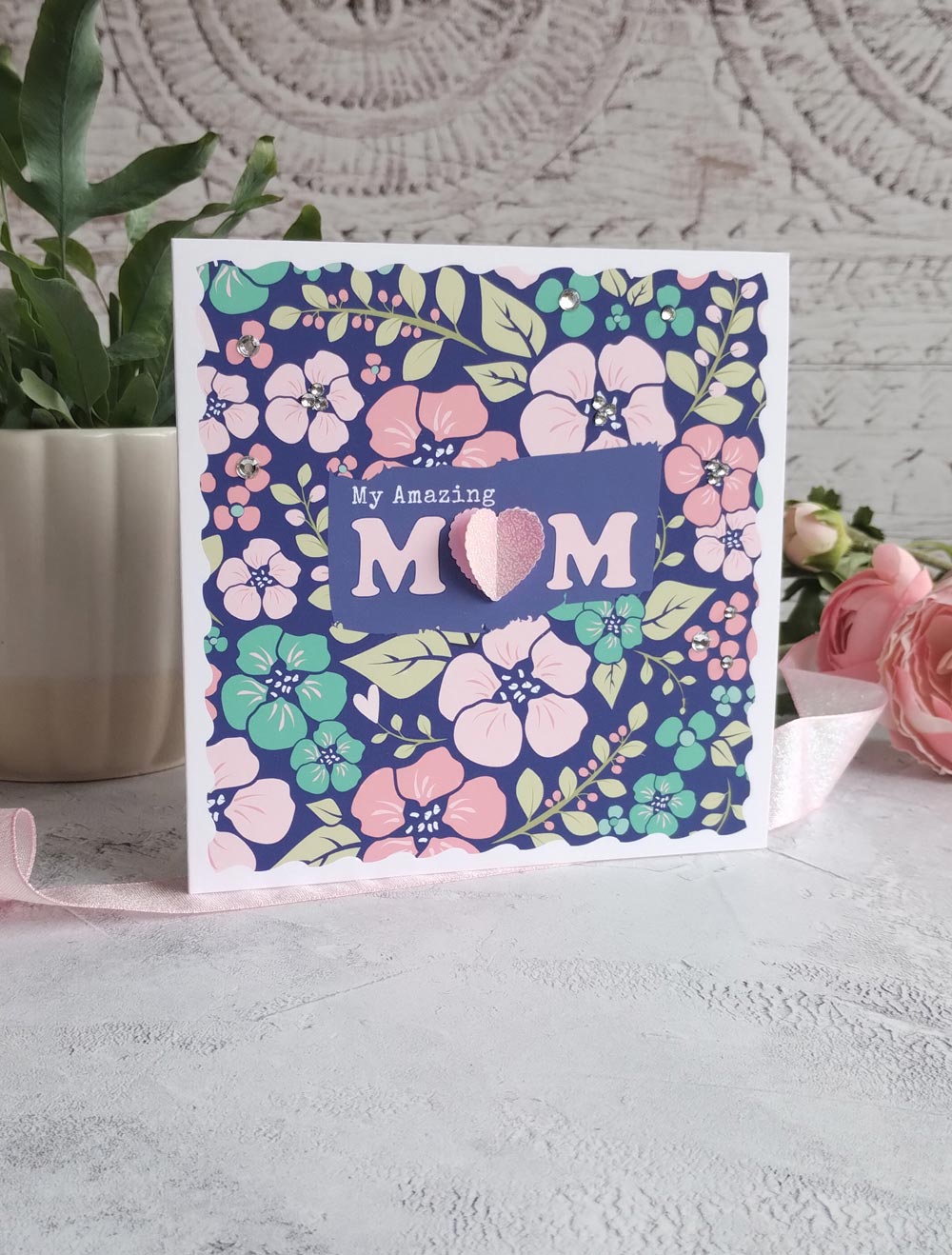 Bold floral Mother's day greeting card with a deep blue background and pink pop-out heart