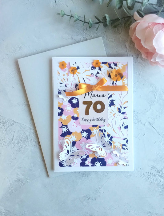 Floral birthday card with stencil cut overlay and number 70 on a light background