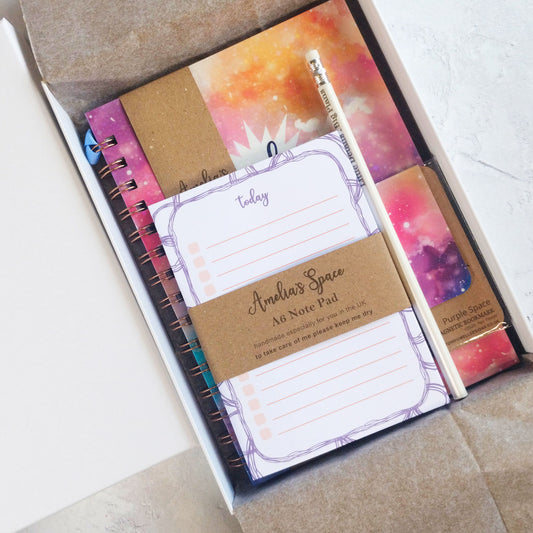 Inside the colourful Dream Space gift box. A5 notebook, A6 notepad, pencil  and magnetic bookmark