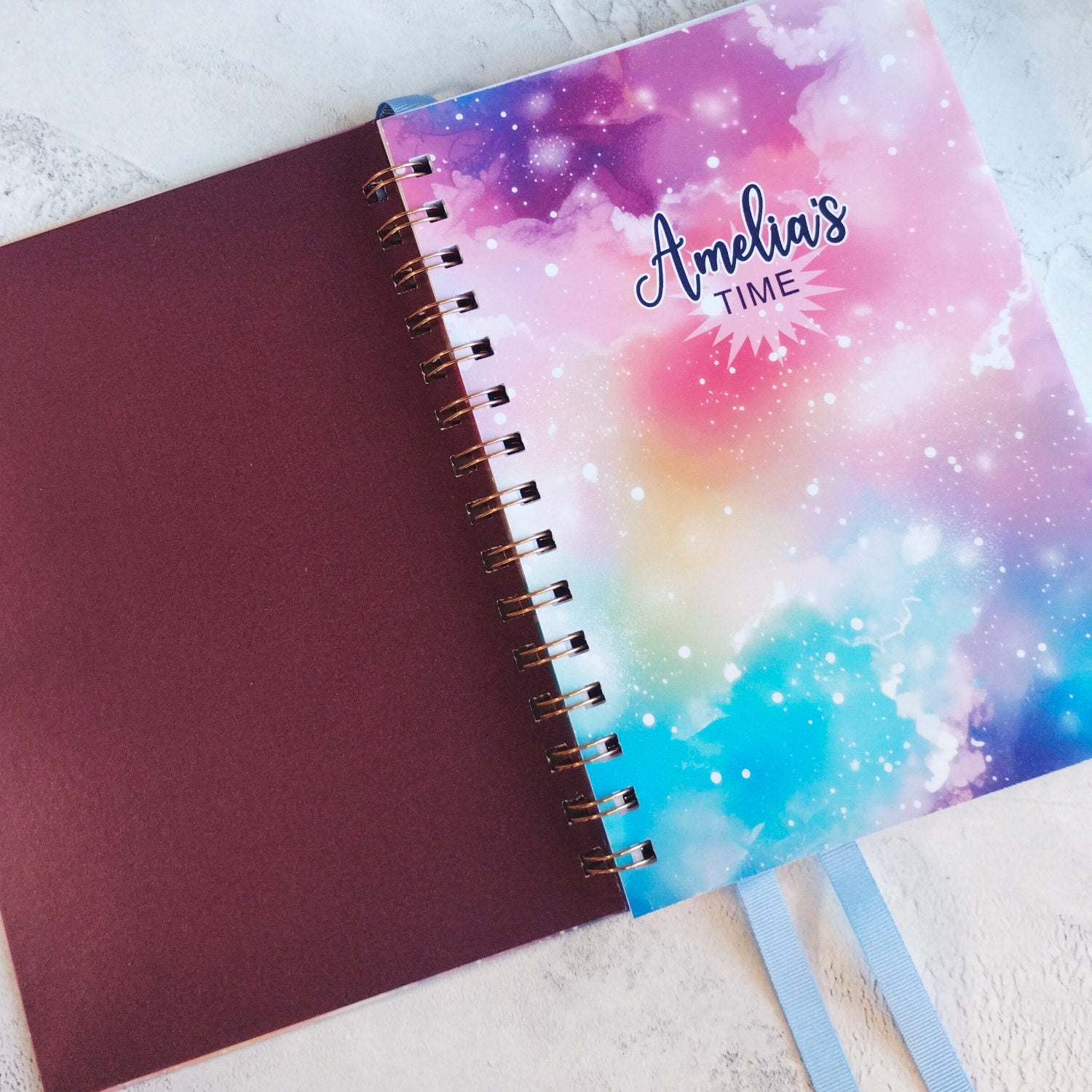 The Dream Space open A5 notebook with peaarlescent maroon inner cover and printed inner page