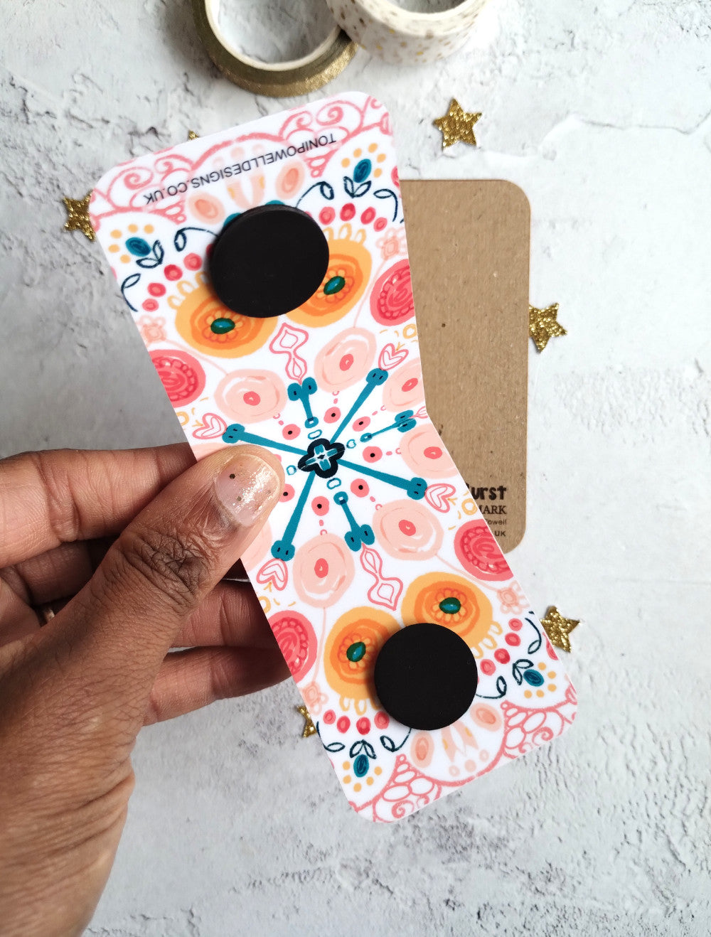 Unfolded Summa Burst Magnetic bookmark with bright colourful pattern design.