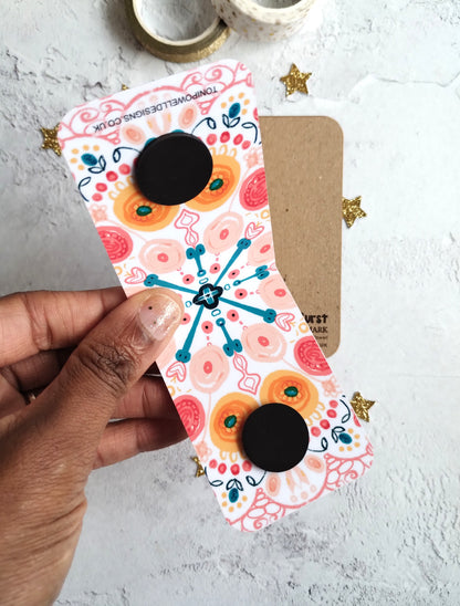 Unfolded Summa Burst Magnetic bookmark with bright colourful pattern design.