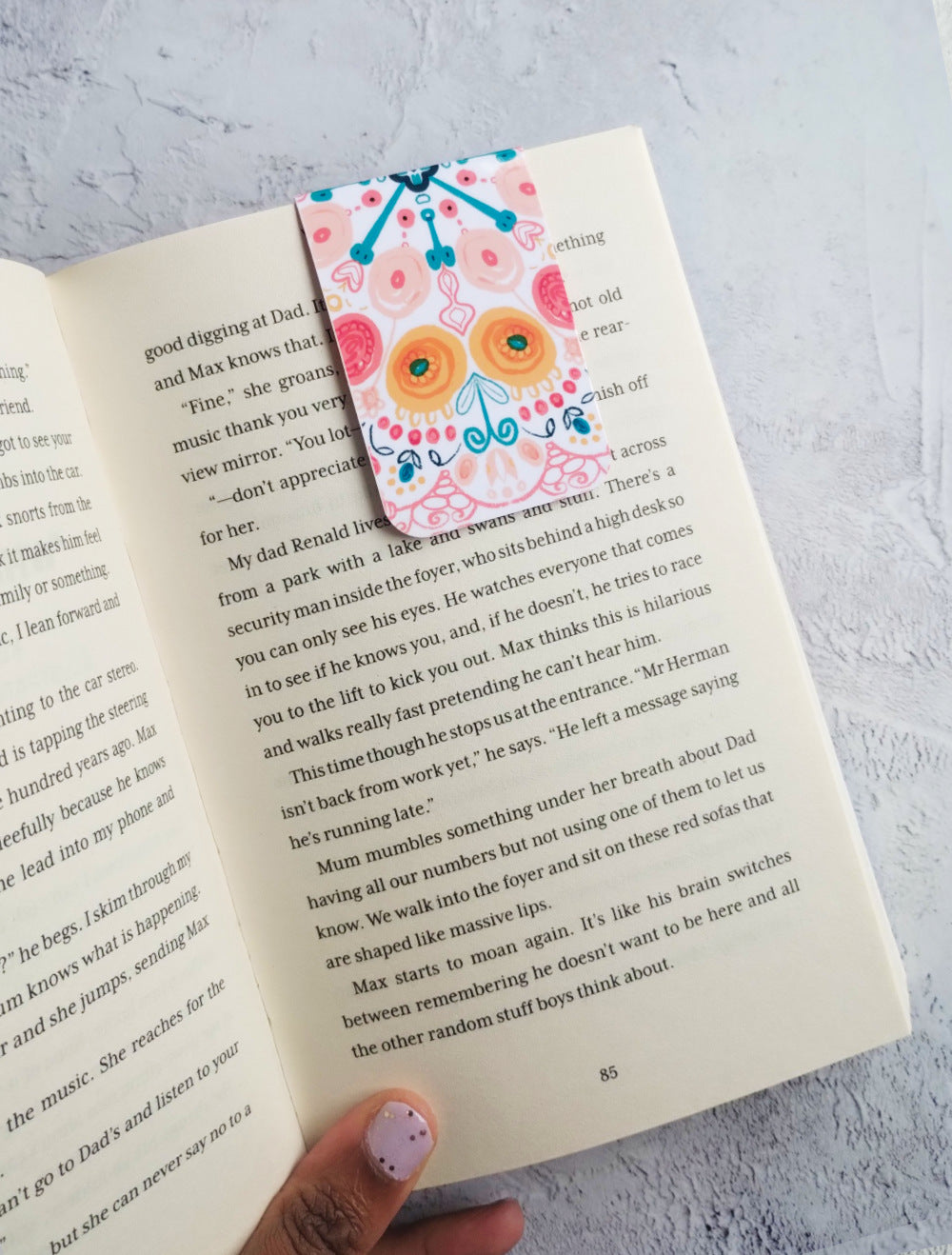 Summa Burst bookmark in an open book 