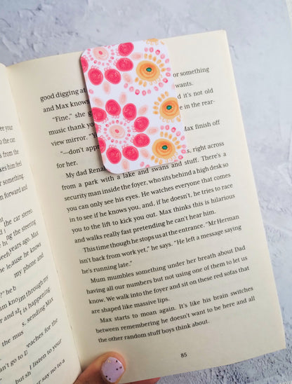 Summa Carnival bookmark in an open book 