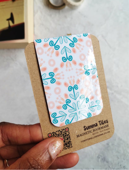 Close-up of glossy Summa Tiles magnetic bookmark with floral design 