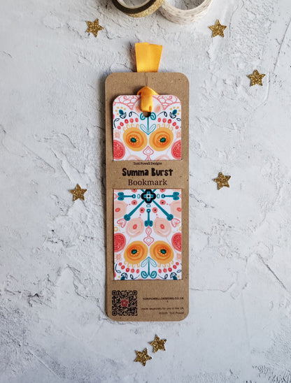 Summa Burst brightly patterned bookmark, embellished with a sunset yellow ribbon, in packaging